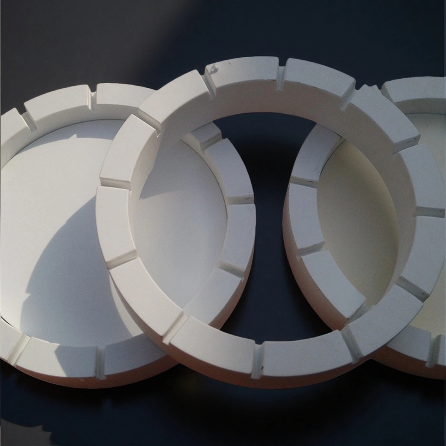 Open-up of a polished alumina ceramic retaining ring, showing its smooth surface finish and precise edge chamfer.