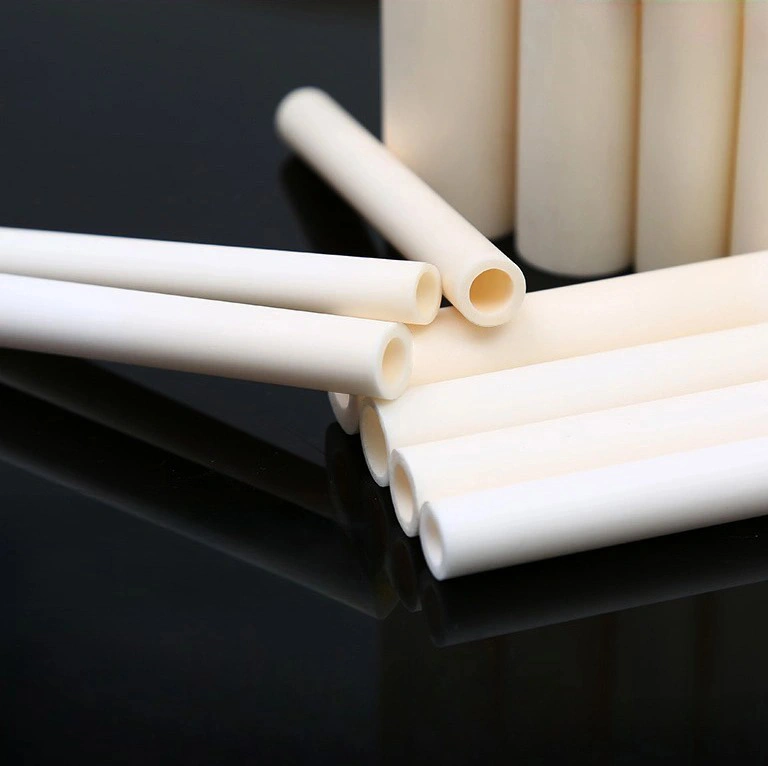 An alumina ceramic process tube installed in a high-temperature laboratory tube furnace, glowing red to show its thermal stability.