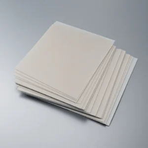 stack of precision ground aluminum nitride sheets for power electronics modules