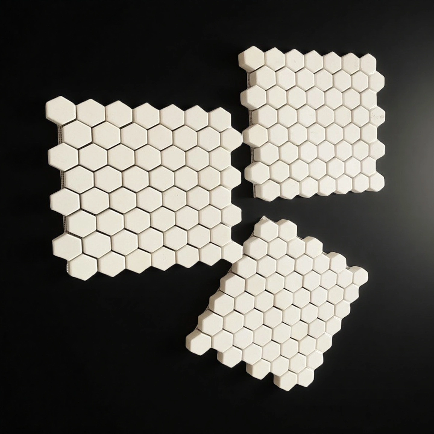 Ceramic mosaic sheet for wear liner application