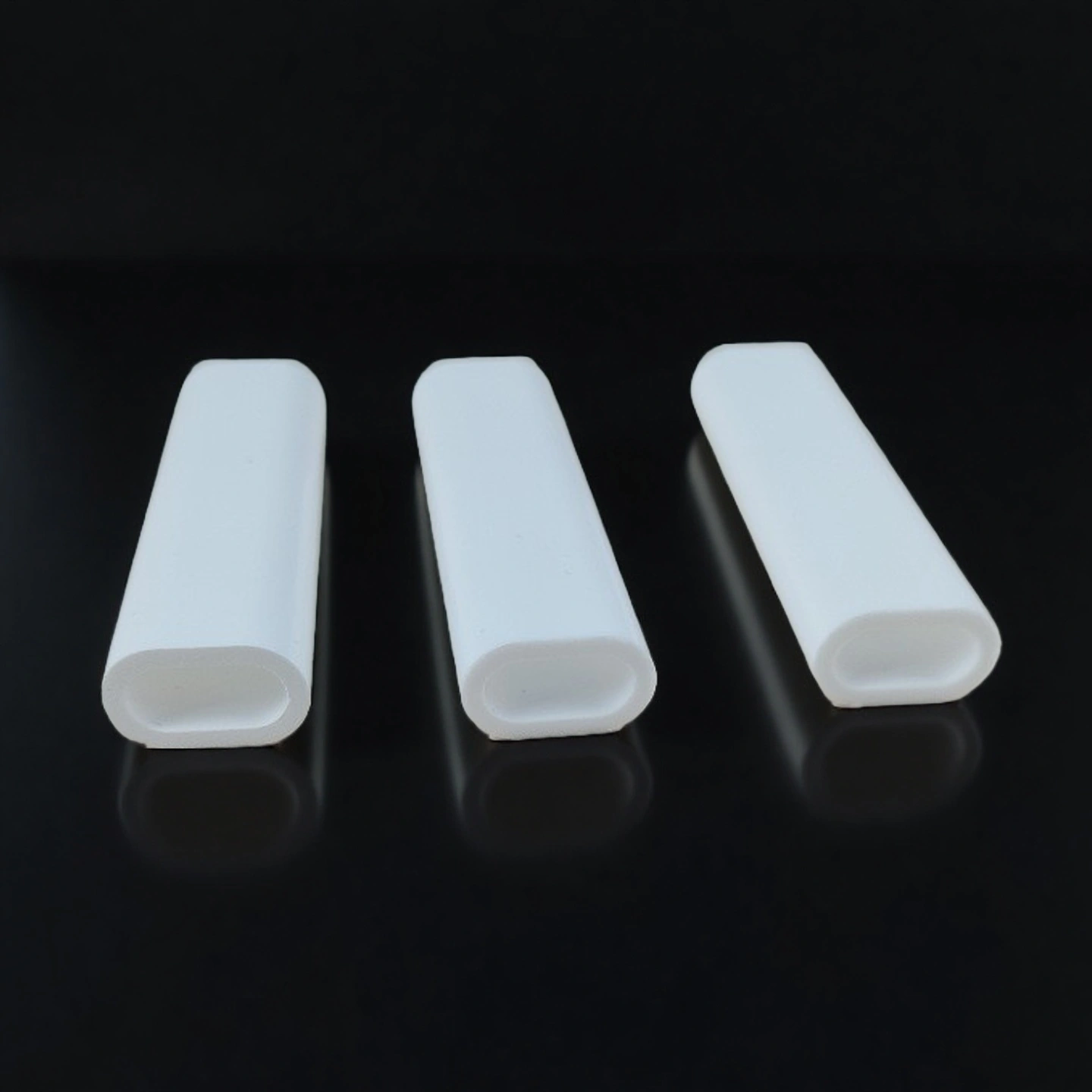 Custom alumina laser reflector with ports and ground datum faces