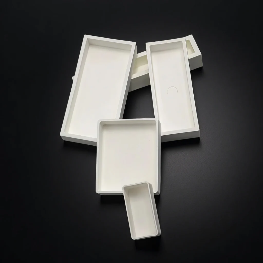 High-temperature crucible for rare earth oxide processing