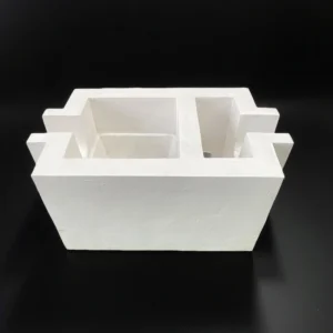 Internal cavity of aluminum silicate filter box showing seating area for ceramic foam filter plate