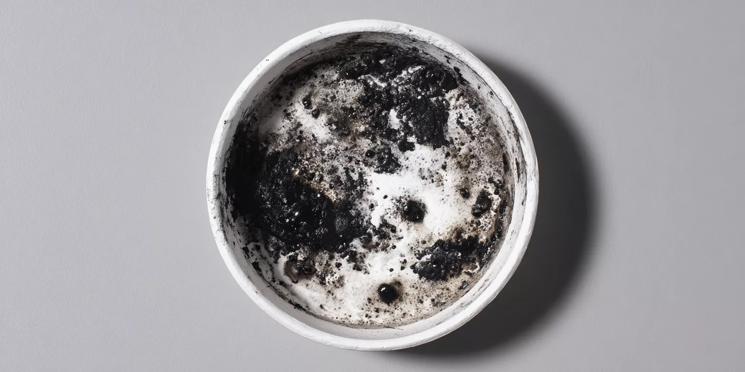 Carbonaceous residue inside white TGA alumina crucible after polymer decomposition