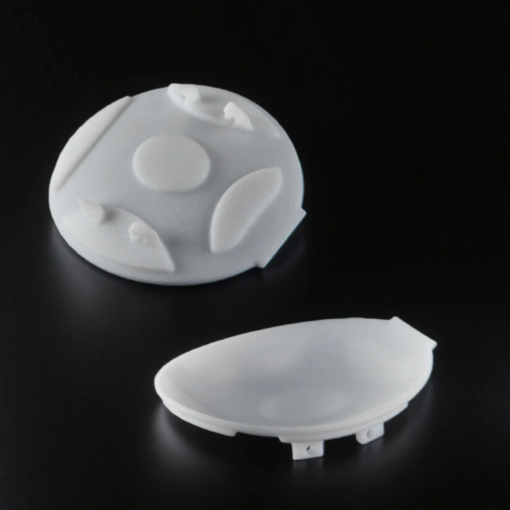 Custom machinable glass ceramic components showing pockets, countersinks and stepped profiles