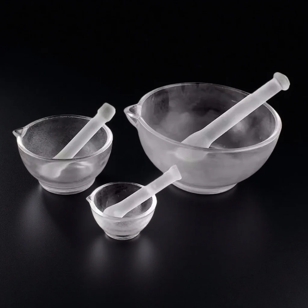 clear glass mortar and pestle set with frosted grinding surfaces and pouring lip