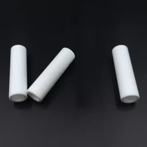 machinable glass ceramic tube machined with side holes and slots for routing and spacing