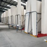 Long alumina ceramic tubes stored vertically in the ADCERAX warehouse