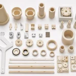 Various custom ceramic components are neatly arranged on a clean studio background to show ceramic manufacturing capabilities.