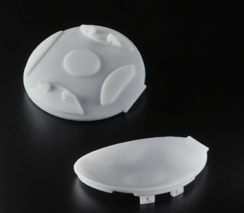 Custom machinable glass ceramic components showing pockets, countersinks and stepped profiles
