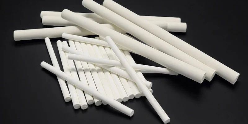 Precision-machined magnesium oxide ceramic rods from China supplier ADCERAX, used for insulation and laboratory equipment.