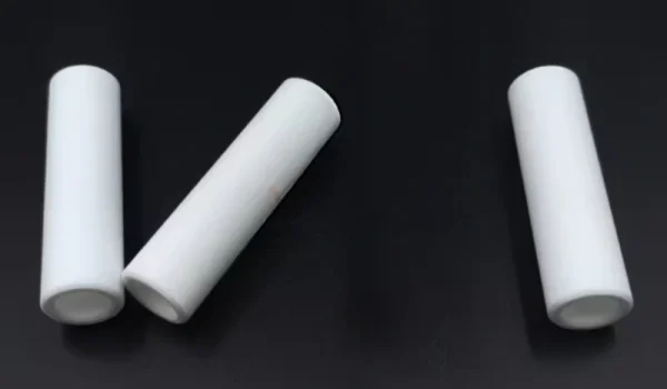 machinable glass ceramic tube machined with side holes and slots for routing and spacing
