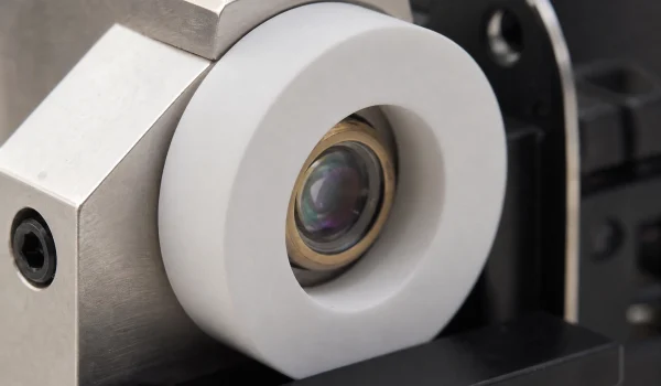 Machinable glass ceramic thermal-isolation ring around a laser diode mount in an optical head