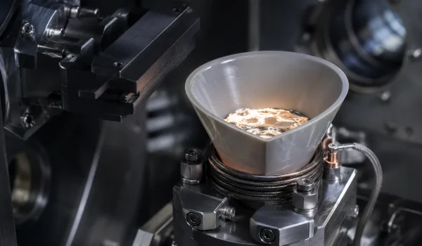 Pyrolytic boron nitride crucible used as an evaporation source in a vacuum deposition chamber